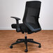 A black Alera office chair with wheels.