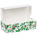 A white box with green leaves and red berries.