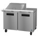 A stainless steel Hoshizaki commercial sandwich prep table with two doors.
