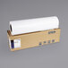 A roll of Epson white premium photo paper on a brown cardboard box.