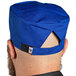 A Uncommon Chef blue chef hat with a hook and loop closure.
