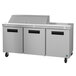 A stainless steel Hoshizaki refrigerated sandwich prep table with three doors.