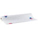 A roll of white paper with red and blue balloon designs.