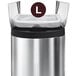 A simplehuman stainless steel trash can with a white custom fit liner inside.