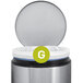 A close up of a simplehuman Code G white trash can liner with a green and white "g" logo.