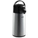 A silver and black Thermos airpot with a push button lid.