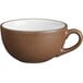 A brown stoneware cup with a white interior and handle.