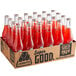 A box of Jarritos Fruit Punch soda bottles with red liquid inside.