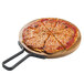 A pizza on a Tablecraft acacia wood serving board with a metal handle.