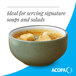 A moss green matte stoneware bowl filled with soup and croutons.