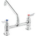 A silver faucet with red and blue knobs.