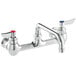 A chrome Waterloo wall-mounted faucet with red and blue knobs.
