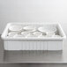 A white Metro tote box with white dividers holding white bowls.