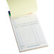 An Adams 2-part carbonless sales order book with yellow paper inside.