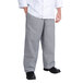 A person wearing Chef Revival houndstooth chef pants and a white chef coat.