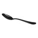 A black, shiny, metal spoon with a curved handle is shown against a white background.