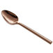 An Acopa Phoenix stainless steel teaspoon with a rose gold handle.
