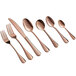 A close-up of a set of twelve rose gold Acopa Vernon bouillon spoons.