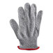 A grey knitted glove with red trim.