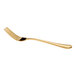A gold-colored fork with a simple, elegant design is shown against a white background.