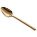 An Acopa Phoenix gold stainless steel teaspoon with a long handle.