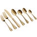 A close-up of Acopa Vernon gold stainless steel spoons.