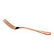 A rose gold-colored metal fork with a smooth, slightly curved handle and four tines, shown on a white background.