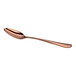 A rose gold-colored metal spoon with an elongated oval bowl and a gently curved handle, shown on a white background.