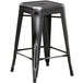 Lancaster Table & Seating Alloy Series Distressed Black Stackable Metal Indoor / Outdoor Industrial Cafe Counter Height Stool with Drain Hole Seat Main Thumbnail 3
