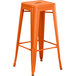 Lancaster Table & Seating Alloy Series Orange Stackable Metal Indoor / Outdoor Industrial Barstool with Drain Hole Seat Main Thumbnail 3