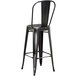 Lancaster Table & Seating Alloy Series Distressed Black Metal Indoor / Outdoor Industrial Cafe Barstool with Vertical Slat Back and Drain Hole Seat Main Thumbnail 4
