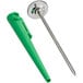 A green metal tool with a screwdriver and calibration wrench.