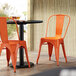 Lancaster Table & Seating Alloy Series Orange Metal Indoor / Outdoor Industrial Cafe Chair with Vertical Slat Back and Drain Hole Seat Main Thumbnail 1