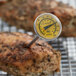 A yellow AvaTemp pocket probe thermometer being used on poultry.