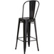 Lancaster Table & Seating Alloy Series Black Metal Indoor / Outdoor Industrial Cafe Barstool with Vertical Slat Back and Drain Hole Seat Main Thumbnail 4