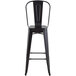 Lancaster Table & Seating Alloy Series Black Metal Indoor / Outdoor Industrial Cafe Barstool with Vertical Slat Back and Drain Hole Seat Main Thumbnail 5