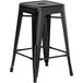 Lancaster Table & Seating Alloy Series Black Stackable Metal Indoor / Outdoor Industrial Cafe Counter Height Stool with Drain Hole Seat Main Thumbnail 3