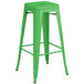 A green Lancaster Table & Seating outdoor barstool with metal legs.
