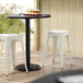 Lancaster Table & Seating Alloy Series White Stackable Metal Indoor / Outdoor Industrial Cafe Counter Height Stool with Drain Hole Seat Main Thumbnail 1