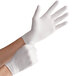 A person wearing small Noble Products nitrile gloves.