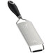 A close-up of a Mercer Culinary stainless steel ribbon grater with a black Santoprene handle.