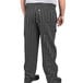 A person wearing Uncommon Chef black and white pinstripe cargo chef pants.
