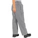 Uncommon Chef customizable houndstooth cargo pants in black and white with a person wearing them.