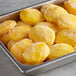 A tray of frozen Dole mango halves.