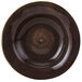 A close-up of a brown Tuxton soup bowl with a black rim.
