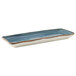 A rectangular white china tray with blue and gold geode accents.