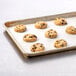 A tray of Rich's Jacqueline vegan chocolate chip cookies on a white surface.