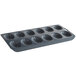 A Fox Run carbon steel Madeleine sheet pan with 12 compartments.