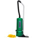 A Bissell Commercial green backpack vacuum cleaner with a yellow hose.