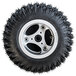 A close up of a Magliner pneumatic tire with an aggressive tread on a black rim with spokes.